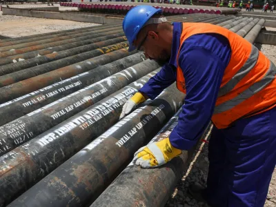 A worker checks gas pipelines at TotalEnergies logistics base at Beirut Port, Lebanon July 25, 2023. REUTERS/Mohamed Azakir