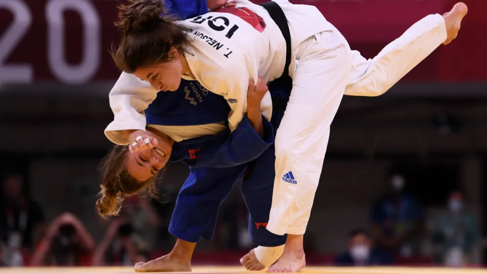 Tokyo 2020 Olympics - Judo - Women's 57kg - Repechage Round - Nippon Budokan - Tokyo, Japan - July 26, 2021. Kaja Kajzer of Slovenia scores ippon against Timna Nelson Levy of Israel REUTERS/Annegret Hilse