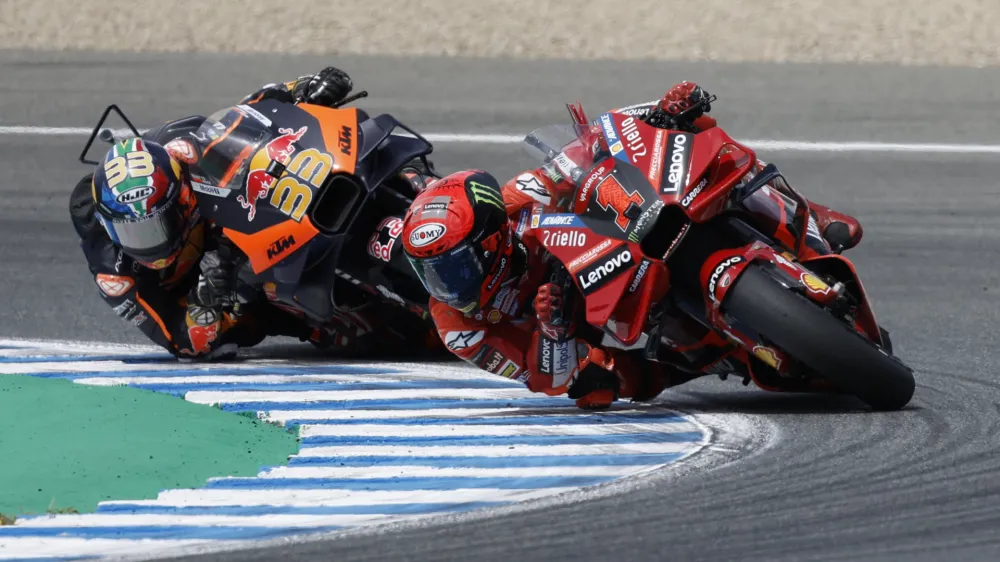 MotoGP - Spanish Grand Prix - Circuito de Jerez, Jerez, Spain - April 30, 2023 Ducati Lenovo Team's Francesco Bagnaia and Red Bull KTM Factory Racing's Brad Binder in action during the race REUTERS/Jon Nazca
