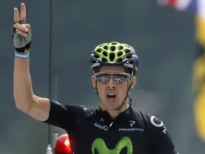 Rui Alberto Costa of Portugal crosses the finish line to win the nineteenth stage of the Tour de France cycling race over 204.5 kilometers (127.8 miles) with start in in Bourg-d'Oisans and finish in Le Grand-Bornand, France, Friday July 19 2013. (AP Photo/Laurent Rebours)