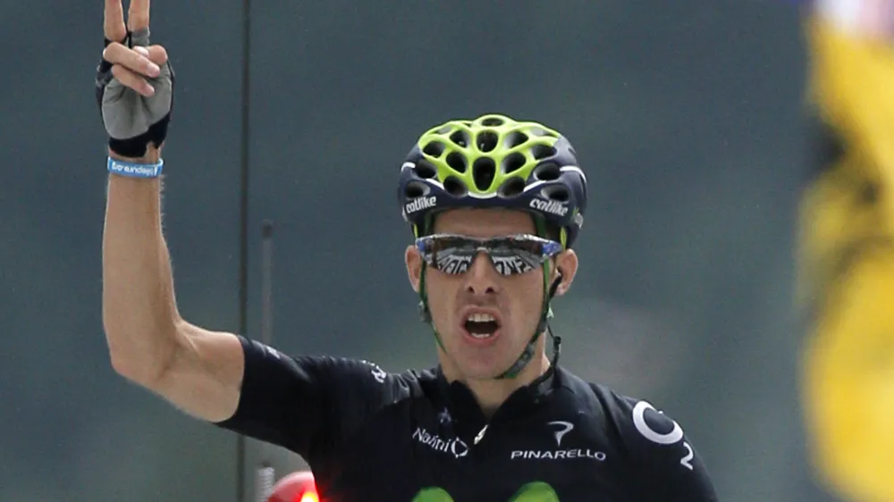 Rui Alberto Costa of Portugal crosses the finish line to win the nineteenth stage of the Tour de France cycling race over 204.5 kilometers (127.8 miles) with start in in Bourg-d'Oisans and finish in Le Grand-Bornand, France, Friday July 19 2013. (AP Photo/Laurent Rebours)