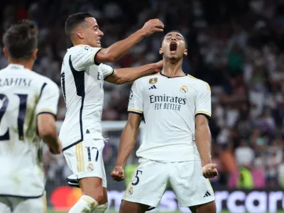 Soccer Football - Champions League - Group C - Real Madrid v 1. FC Union Berlin - Santiago Bernabeu, Madrid, Spain - September 20, 2023 Real Madrid's Jude Bellingham celebrates scoring their first goal with Lucas Vazquez REUTERS/Isabel Infantes