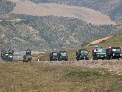FILE PHOTO: Vehicles of Russian peacekeepers leaving Azerbaijan's Nagorno-Karabakh region for Armenia pass an Armenian checkpoint on a road near the village of Kornidzor, Armenia September 22, 2023. REUTERS/Irakli Gedenidze/File Photo