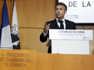 French President Emmanuel Macron addresses the Corsican Assembly in Ajaccio, as part of a three days visit in the southern French island of Corsica Thursday Sept. 28, 2023. President Emmanuel Macron proposed granting limited autonomy for Corsica on Thursday in a modest step toward nationalist sentiment on France's island in the Mediterranean. (Pascal Pochard-Casabianca, Pool via AP)