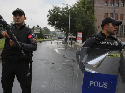 Turkish security forces cordon off an area after an explosion in Ankara, Sunday, Oct. 1, 2023. A suicide bomber detonated an explosive device in the heart of the Turkish capital, Ankara, on Sunday, hours before parliament was scheduled to reopen after a summer recess. A second assailant was killed in a shootout with police. (AP Photo/Ali Unal)