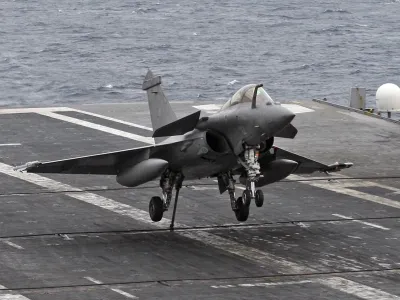 A Rafale fighter jet makes a cable arrest landing on the flight deck of French aircraft carrier "Charles De Gaulle" during sea trials in the Mediterranean sea in this November 26, 2009 file picture. France could start military operations against Libya in a matter of hours following the U.N. Security Council resolution authorising such action, government spokesman Francois Baroin said on March 18, 2011.  REUTERS/Jean-Paul Pelissier/Files (FRANCE - Tags: TRANSPORT MILITARY POLITICS)