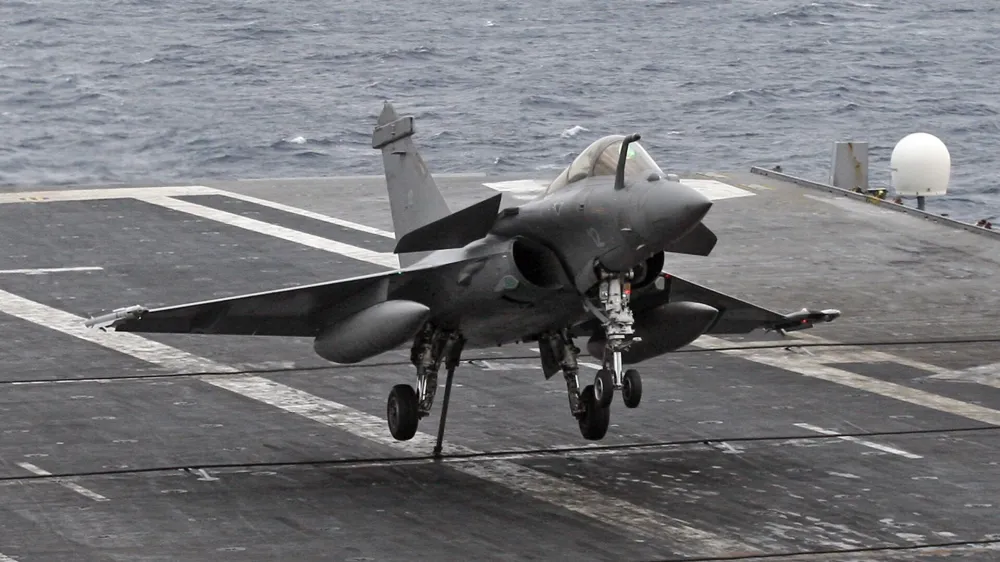 A Rafale fighter jet makes a cable arrest landing on the flight deck of French aircraft carrier "Charles De Gaulle" during sea trials in the Mediterranean sea in this November 26, 2009 file picture. France could start military operations against Libya in a matter of hours following the U.N. Security Council resolution authorising such action, government spokesman Francois Baroin said on March 18, 2011.  REUTERS/Jean-Paul Pelissier/Files (FRANCE - Tags: TRANSPORT MILITARY POLITICS)