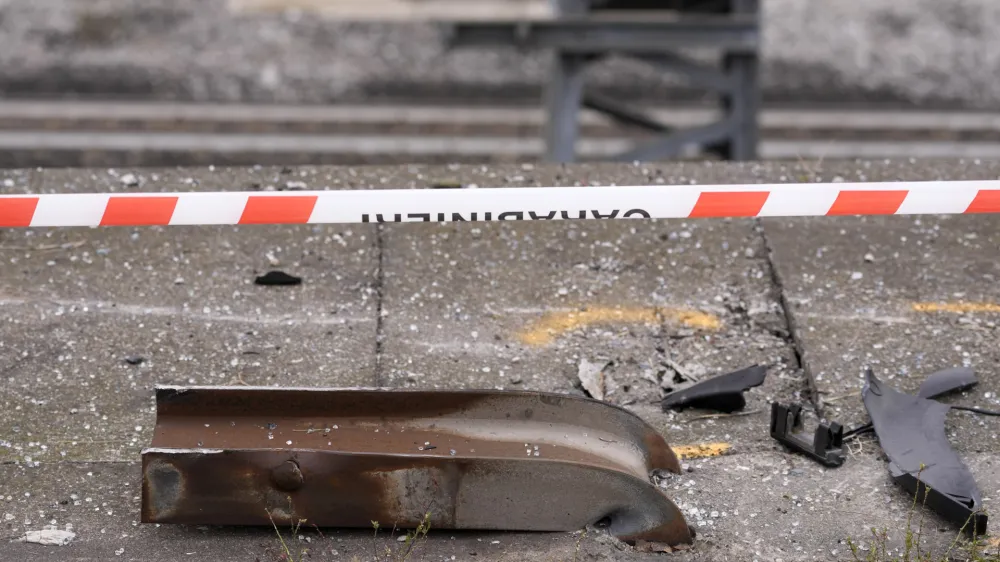 Wreckage of a damaged guardrail lies on the road at the scene of a passenger bus accident in Mestre, near the city of Venice, Italy, Wednesday, Oct. 4, 2023. The bus fell from an elevated road, late Tuesday, killing multiple people. (AP Photo/Antonio Calanni)