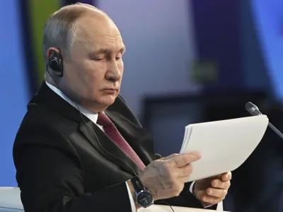 Russian President Vladimir Putin attends a plenary session at the 2023 Russian Energy Week international forum at the Manezh Central Exhibition Hall in Moscow, Russia, Wednesday, Oct. 11, 2023. (Kristina Kormilitsyna, Sputnik, Kremlin Pool Photo via AP)