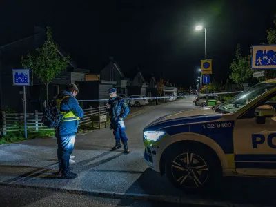 A police officer stands near police tape in Tullinge in Botkyrka, near Stockholm, Sweden, where a shooting took place, according to local media, October 13, 2023. Magnus Lejhall/TT News Agency/via REUTERS   ATTENTION EDITORS - THIS IMAGE WAS PROVIDED BY A THIRD PARTY. SWEDEN OUT. NO COMMERCIAL OR EDITORIAL SALES IN SWEDEN.