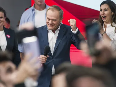 15 October 2023, Poland, Warsaw: Civic Coalition's leader Donald Tusk (C)&nbsp;speaks during the election night after the announcement of the first results of the 2023 Polish parliamentary election. Photo: Attila Husejnow/SOPA Images via ZUMA Press Wire/dpa
