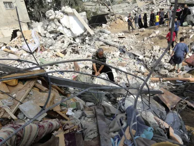 Palestinians inspect the damage of a destroyed house following Israeli airstrikes on Gaza City, Wednesday, Nov. 8, 2023. (AP Photo/Abed Khaled)