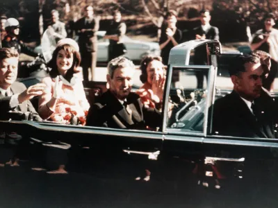 Prior to the assassination, President John F Kennedy, First Lady Jacqueline Kennedy, and Texas Governor John Connally ride through the streets of Dallas, Texas on November 22, 1963. Included as an exhibit for the Warren Commission. (Photo by &copy; CORBIS/Corbis via Getty Images)