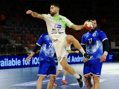 Handball - 2021 IHF Handball World Championship - Preliminary Round Group H - Russia v Slovenia - Handball Hall Borg Al Arab, Alexandria, Egypt - January 16, 2021 Slovenia's Blaz Janc in action IHF/Handout via REUTERS/Hazem_gouda NO ARCHIVES. THIS IMAGE HAS BEEN SUPPLIED BY A THIRD PARTY. IT IS DISTRIBUTED, EXACTLY AS RECEIVED BY REUTERS, AS A SERVICE TO CLIENTS.