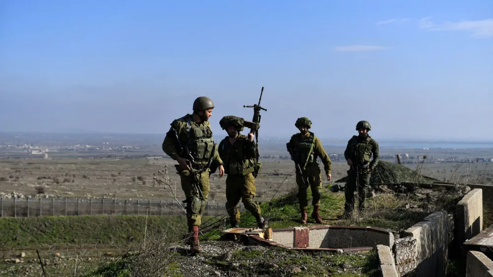Israeli soldiers operate in the Israeli-occupied Golan Heights near the border with Syria, amid the ongoing conflict between Israel and the Palestinian Islamist group Hamas, December 28, 2023. REUTERS/Gil Eliyahu ISRAEL OUT. NO COMMERCIAL OR EDITORIAL SALES IN ISRAEL   TPX IMAGES OF THE DAY
