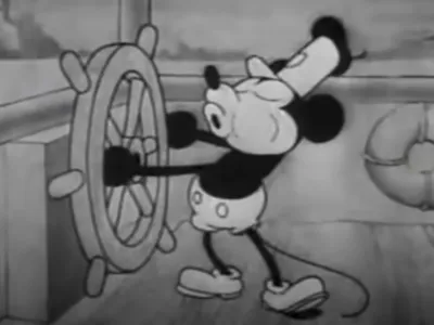 This still image from video provided by Disney shows the character Mickey Mouse in the 1928 animated short "Steamboat Willie." On Monday, Jan. 1, 2024, the iconic character from "Steamboat Willie" entered the public domain after the expiration of the 95-year copyright, and is already the focus of two horror films. (Disney via AP)