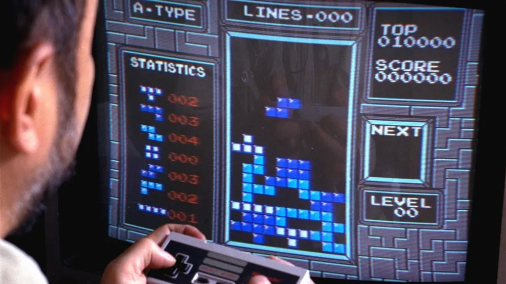 Tetris, an addictive brain-teasing video game, is shown as played on the Nintendo Entertainment System in New York, June 1990. Created by a Soviet scientist, Tetris is the first Communist bloc video game to hit it big in the free market. (AP Photo/Richard Drew)