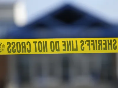 A police tape is seen in front of the Perry Middle School entrance following a shooting at the nearby Perry High School, Thursday, Jan. 4, 2024, in Perry, Iowa. Multiple people were shot inside the school early Thursday as students prepared to start their first day of classes after their annual winter break, authorities said. (AP Photo/Charlie Neibergall)