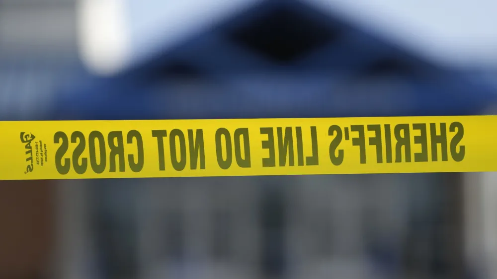 A police tape is seen in front of the Perry Middle School entrance following a shooting at the nearby Perry High School, Thursday, Jan. 4, 2024, in Perry, Iowa. Multiple people were shot inside the school early Thursday as students prepared to start their first day of classes after their annual winter break, authorities said. (AP Photo/Charlie Neibergall)
