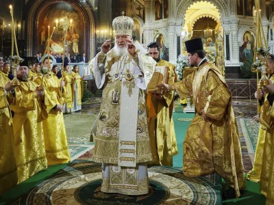 In this photo released by Russian Orthodox Church Press Service, Russian Orthodox Patriarch Kirill, center, delivers the Christmas service in the Christ the Saviour Cathedral in Moscow, Russia, on Saturday, Jan. 6, 2024. While much of the world has Christmas in the rearview mirror by now, people in some Eastern Orthodox traditions celebrate the holy day on Sunday, Jan. 7. (Oleg Varov, Russian Orthodox Church Press Service via AP)