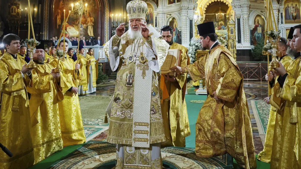 In this photo released by Russian Orthodox Church Press Service, Russian Orthodox Patriarch Kirill, center, delivers the Christmas service in the Christ the Saviour Cathedral in Moscow, Russia, on Saturday, Jan. 6, 2024. While much of the world has Christmas in the rearview mirror by now, people in some Eastern Orthodox traditions celebrate the holy day on Sunday, Jan. 7. (Oleg Varov, Russian Orthodox Church Press Service via AP)