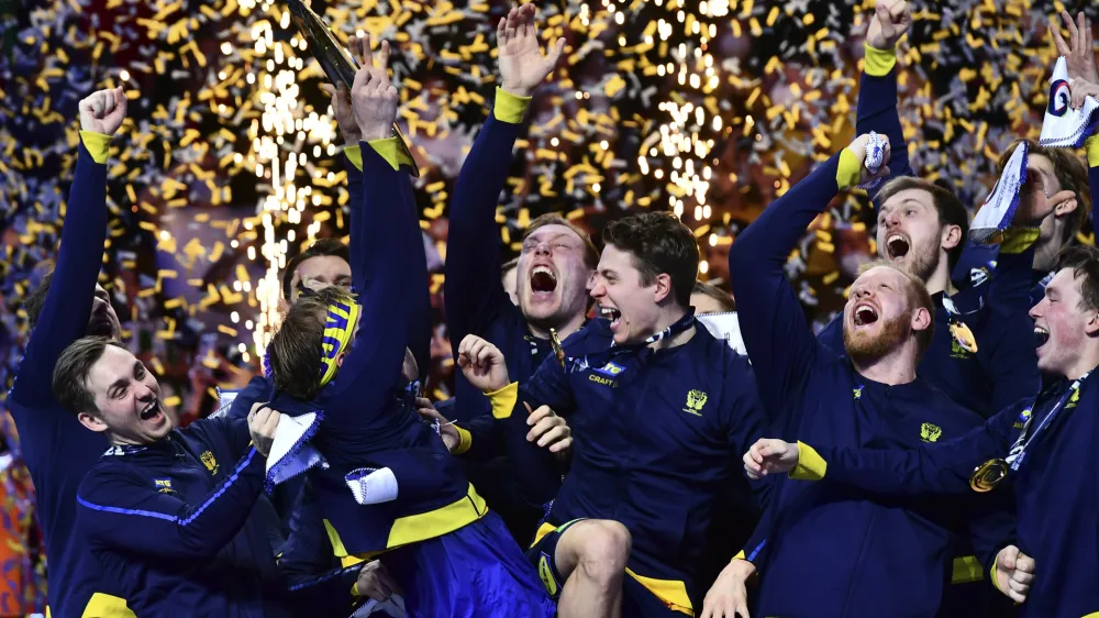 Swedish players celebrate their victory at the end of the Men's European Handball Championship final match between Sweden and Spain, in Budapest, Hungary, Sunday, Jan. 30, 2022. (AP Photo/Anna Szilagyi)