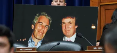 Rep. Jared Moskowitz (D-FL) holds up a photo of former U.S. President Donald Trump with late sex offender Jeffrey Epstein during a meeting of the the House Oversight and Accountability Committee to markup a resolution and report to hold Hunter Biden, President Joe Biden's son, in contempt of Congress, after he refused to appear for a closed-door deposition, at the Capitol in Washington, U.S., January 10, 2024. REUTERS/Kevin Lamarque
