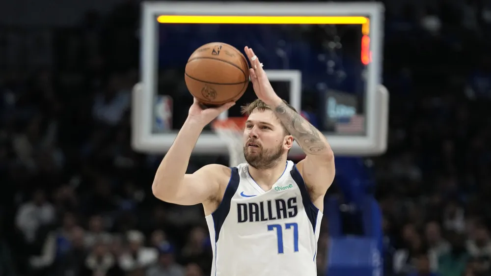 Dallas Mavericks guard Luka Doncic shoots during the second half of an NBA basketball game against the Memphis Grizzlies in Dallas, Tuesday, Jan. 9, 2024. (AP Photo/LM Otero)