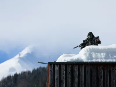 A police officer works on a roof ahead of the annual meeting of the World Economic Forum (WEF) in Davos, Switzerland, January 15, 2024. REUTERS/Denis Balibouse