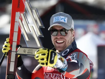 Norway's Aleksander Aamodt Kilde celebrates winning an alpine ski, men's World Cup super-G, in Kvitfjell, Norway, Sunday March 6, 2022. (AP Photo/Gabriele Facciotti)