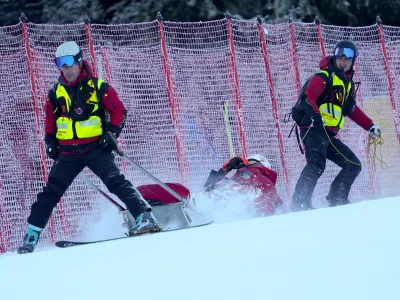 Slovakia's Petra Vlhova is carried down with a toboggan after falling during the first run of an alpine ski, women's World Cup giant slalom race, in Jasna, Slovakia, Saturday, Jan. 20, 2024.(AP Photo/Pier Marco Tacca)