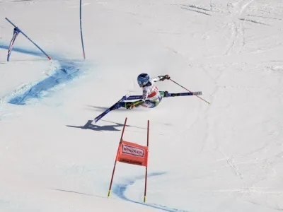 Slovenia's Meta Hrovat falls during the second run of an alpine ski, women's World Cup giant slalom, in Lenzerheide, Switzerland, Sunday, March 6, 2022. (AP Photo/Giovanni Auletta)