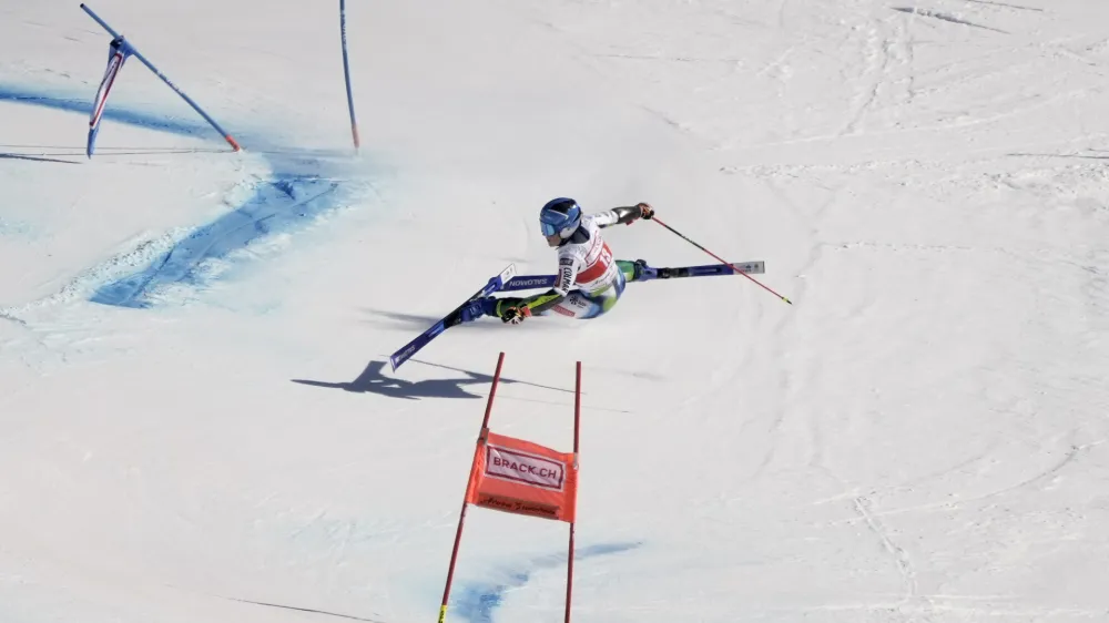 Slovenia's Meta Hrovat falls during the second run of an alpine ski, women's World Cup giant slalom, in Lenzerheide, Switzerland, Sunday, March 6, 2022. (AP Photo/Giovanni Auletta)