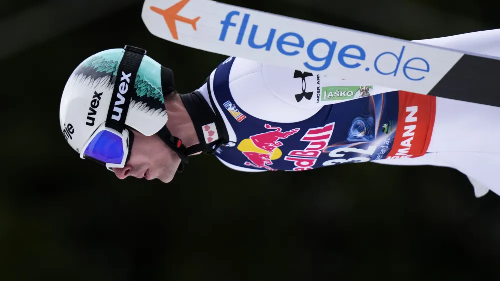 Timi Zajc, of Slovenia, soars through the air during his first round jump of the ski flying world championships, at the Kulmkogel mountain in Bad Mitterndorf, Austria, Friday, Jan. 26, 2024. (AP Photo/Matthias Schrader)