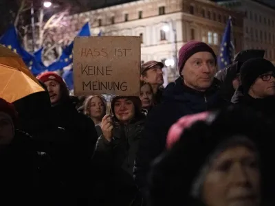 People gather in front of the Austrian parliament building, as they attend a demonstration under the slogan #TogetherAgainstRight to protest against right-wing extremism and for the protection of democracy, in Vienna, Austria, January 26, 2024. REUTERS/Elisabeth Mandl