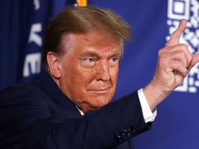 FILE PHOTO: Former U.S. President and Republican presidential candidate Donald Trump gestures as he attends a rally in advance of the New Hampshire primary election in Laconia, New Hampshire, U.S. January 22, 2024. REUTERS/Mike Segar/File Photo