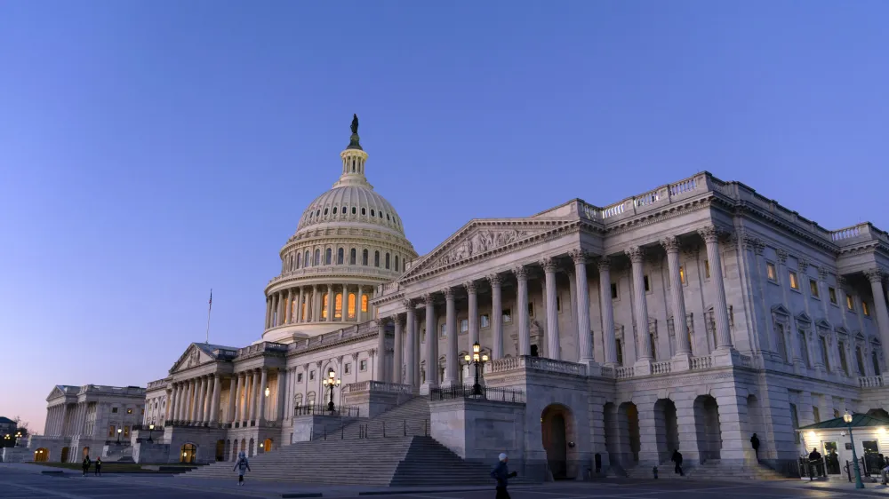 The U.S. Capitol is seen at sunrise, Wednesday, Feb. 7, 2024, in Washington. A Senate deal on border enforcement measures and Ukraine aid has suffered swift and total collapse. Republicans withdrew support despite President Joe Biden urging Congress to "show some spine" and stand up to Donald Trump. But Senate Republican Leader Mitch McConnell says that a deal to pair border policy changes with $60 billion in wartime aid for Ukraine is dead. (AP Photo/Jose Luis Magana)