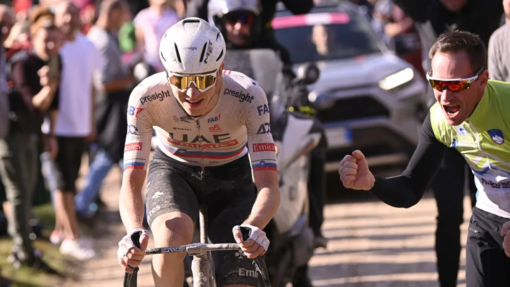 Slovenia's Tadej Pogacar competes during the men's Strade Bianche' (White Roads) cycling race from and to Siena, Italy, Saturday, March 2, 2024. (Fabio Ferrari/LaPresse via AP)