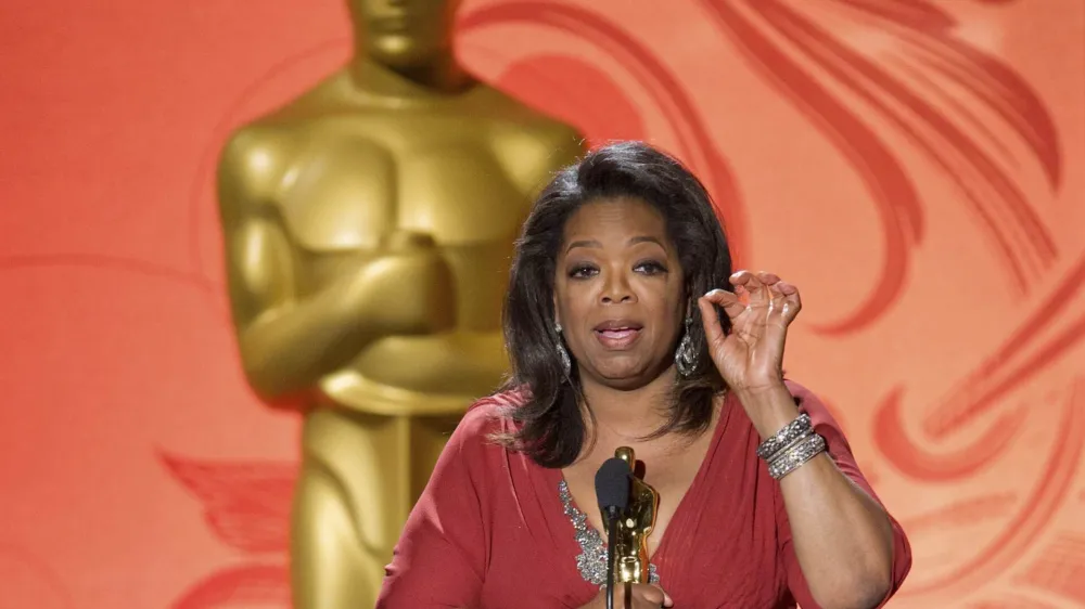 Jean Hersholt Humanitarian Award recipient Oprah Winfrey speaks after accepting her Oscar statuette at the Academy of Motion Picture Arts & Sciences 2011 Governors Awards in Hollywood, California November 12, 2011. REUTERS/Todd Wawrychuk/A.M.P.A.S./Handout (UNITED STATES - Tags: ENTERTAINMENT) NO SALES. NO ARCHIVES. FOR EDITORIAL USE ONLY. NOT FOR SALE FOR MARKETING OR ADVERTISING CAMPAIGNS