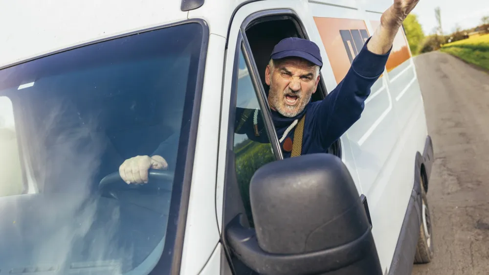 Angry driver shouting in his vehicle