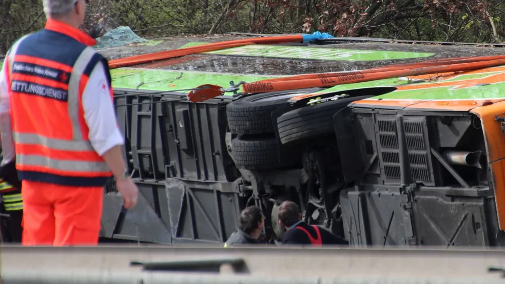 Emergency staff talk at the scene after several people were killed and more injured in a coach crash on the A9 motorway off Schkeuditz, near the eastern German city of Leipzig, Germany, March 27, 2024.  REUTERS/Marvin Matzulla/Mitteldeutsche Zeitung