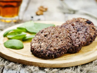 black beans brown rice walnut oat burgers with spinach. toning. selective focus