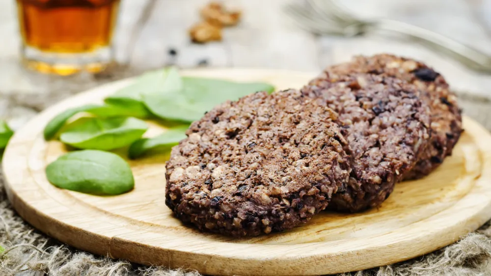 black beans brown rice walnut oat burgers with spinach. toning. selective focus