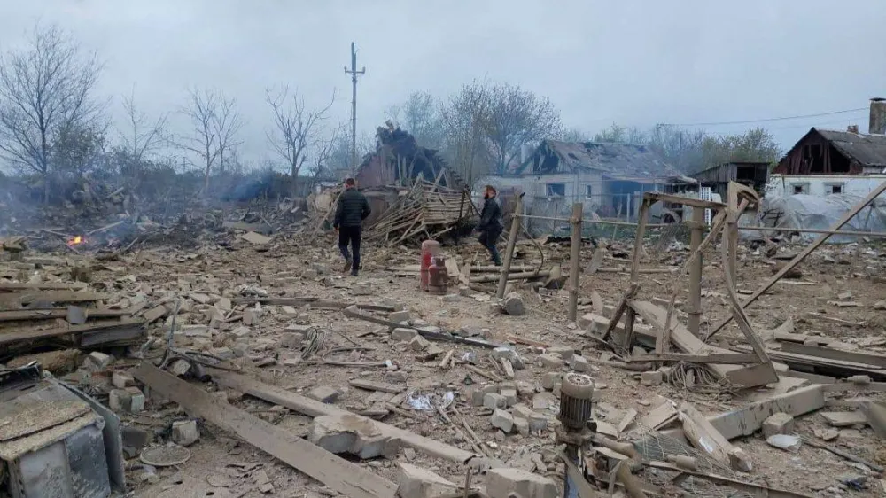 People are seen at the site of a residential area hit by a Russian military strike, amid Russia's attack on Ukraine, in the town of Pavlohrad, Dnipropetrovsk region, Ukraine May 1, 2023. Governor of Dnipropetrovsk Regional Military-Civil Administration Serhii Lysak via Telegram/Handout via REUTERS ATTENTION EDITORS - THIS IMAGE HAS BEEN SUPPLIED BY A THIRD PARTY. NO RESALES. NO ARCHIVES.