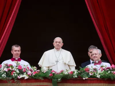 Pope Francis stands on a balcony, on the day he delivers his "Urbi et Orbi" (To the city and the world) message at St. Peter's Square, on Easter Sunday, at the Vatican March 31, 2024. REUTERS/Yara Nardi