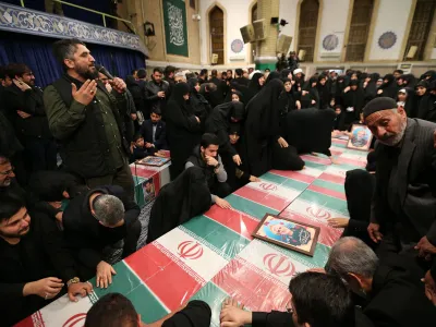04 April 2024, Iran, Tehran: People&nbsp;mourn around the coffins of seven Revolutionary Guard Corps members who were killed in a strike on the country's consular in Damascus, which Tehran blamed on Israel, ahead of their funeral procession. Photo: -/Iranian Supreme leader's Office/dpa - ATTENTION: editorial use only and only if the credit mentioned above is referenced in full