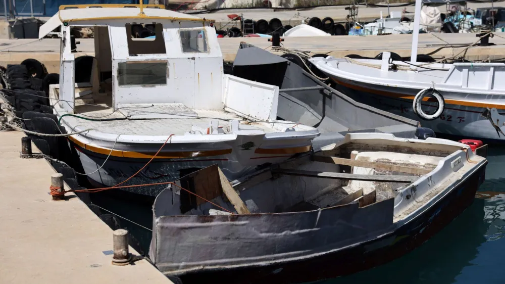 Boats used by migrants are moored at a fishing shelter in Paralimni, Cyprus, April 5, 2024. This week the island has seen un unprecedented influx of hundreds of refugees from Syria, whom Cypriot authorities said set off from the coast of Lebanon. REUTERS/Yiannis Kourtoglou