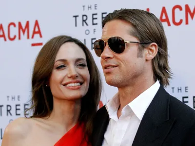 FILE PHOTO: Cast member Brad Pitt and actress Angelina Jolie pose at the premiere of "The Tree of Life" at LACMA in Los Angeles May 24, 2011. REUTERS/Mario Anzuoni
