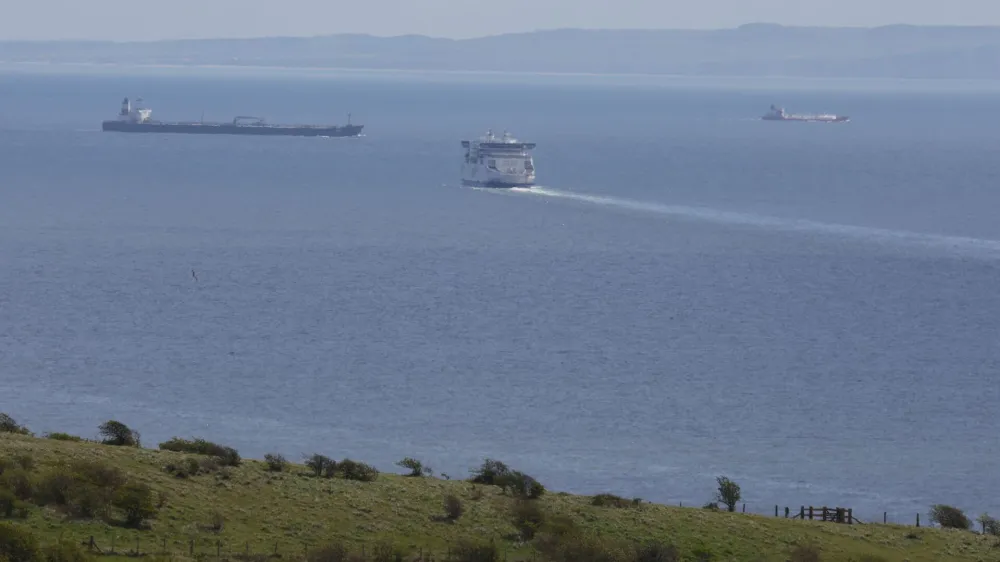 A cross-channel ferry sails towards northern France amid cargo ships, as viewed from the coastal port town of Dover, Britain, April 18, 2024. REUTERS/Toby Melville