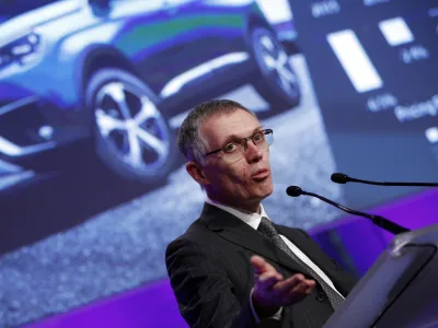 PSA Peugeot Citroen Chief Executive Carlos Tavares delivers his speech during the presentation of the company's 2016 full year results, in Paris, Thursday, Feb.23, 2017. French carmaker PSA Group saw its profits jump last year and is giving dividends for the first time since 2011, burnishing its image as it weighs a buyout of General Motors' money-losing European operations. (AP Photo/Christophe Ena)